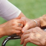 Nurse Holding Elderly Patient’s Hand